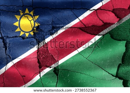 Namibia flag represented on a cracked surface, reflecting national difficulties and instability