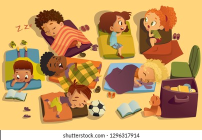 Nap Time In The Kindergarten. Group Of Multiracial Girls And Boys Have A Nip Time At A Colorfill Nap Mats. Preschool Dream Time. Two Girls Gossip During Daytime Sleep