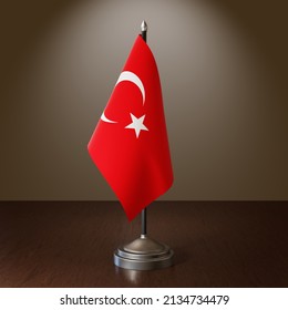 National flag of Turkiye. Table flag of Turkey. Metallic stand with glossy reflection. Silver base. Spotlight in the background. High quality. Large size. 3D rendering.
