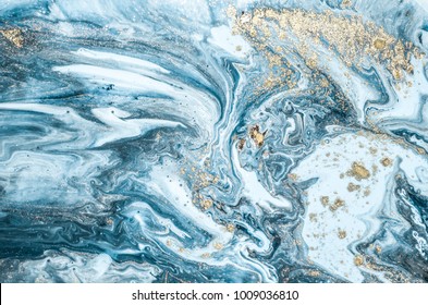 Natural Luxury. Marbleized effect. Ancient oriental drawing technique. Marble texture. Beautiful pattern. Oriental art. Marbling background. White and blue mixed acrylic paints golden powder. 