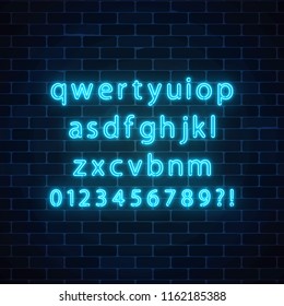  Neon Style Font. Glowing Neon Alphabet With Lowercase Letters On Dark Brick Wall Background.