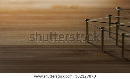 Network, networking, connect, wire. Linking entities. Network of gold wires on rustic wood. 