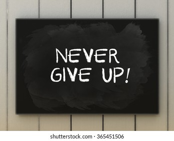 Never give up blackboard written and chalk  Business concept 