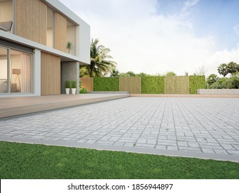 New House With Empty Cobblestone Floor For Car Park. 3d Rendering Of Green Grass Lawn In Modern Home.