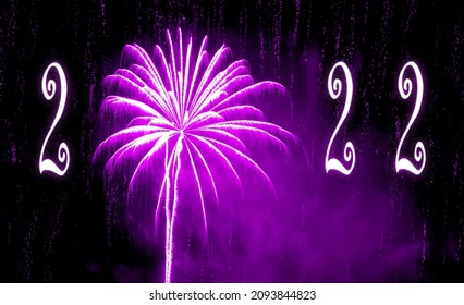 New Year 2022. Purple firework with purple smoke and glittering background. Text 2022.