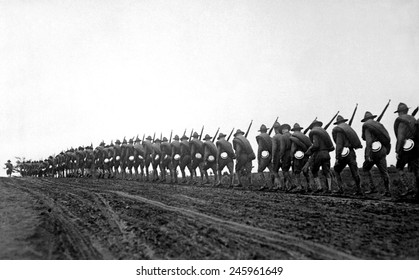 New York National Guard, silhouetted against the sky as they march to the training camp. WWI. Sept. 5, 1917.