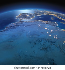 Night planet Earth with precise detailed relief and city lights illuminated by moonlight. North Africa. Algeria, Morocco and Tunisia. Elements of this image furnished by NASA