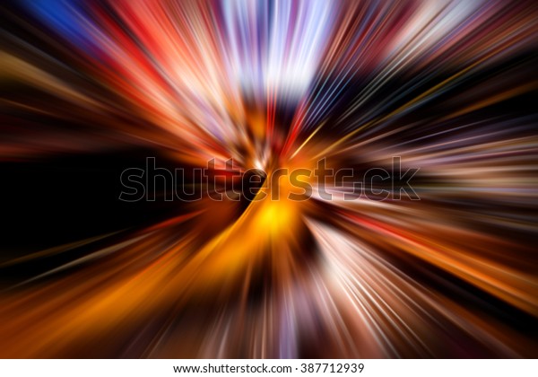 Night traffic in the city, car lights in motion\
blur with zoom\
effect