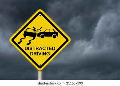 No Distracted Driving Sign, Yellow Warning Sign With Words Distracted Driving And Accident Icon With Stormy Sky Background