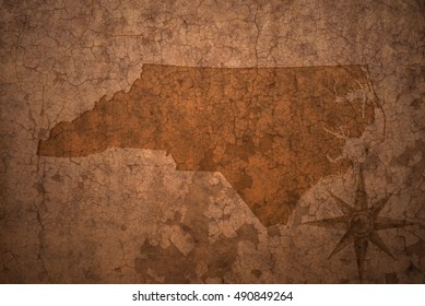 north carolina state map on a old vintage crack paper background