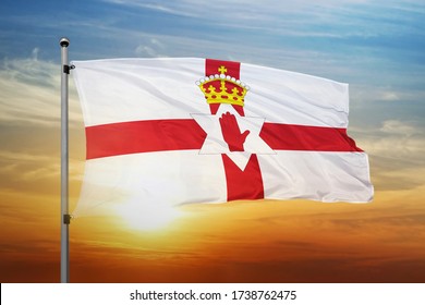 Northern Ireland flag waving with cloudy blue sky. Northern Ireland realistic 3D waving flag.
