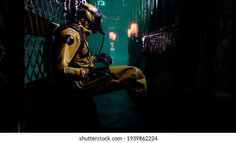 A Nuclear Physicist Sits On A Neon Street And Checks The Surrounding Radiation With A Dosimeter. Post-apocalyptic World Concept. 3D Rendering.