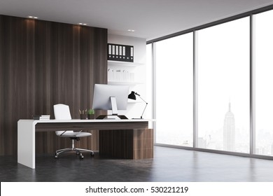 Office Of A Head Of A Company With Dark Wood Walls, A Panoramic Window And A Table With Computer On It. 3d Rendering. Mock Up. 