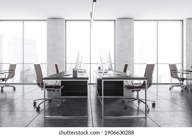 Office Room With Armchairs And Computers On The Tables In A Row Near Windows. Light Grey Office Room With Modern Minimalist Furniture, 3D Rendering No People