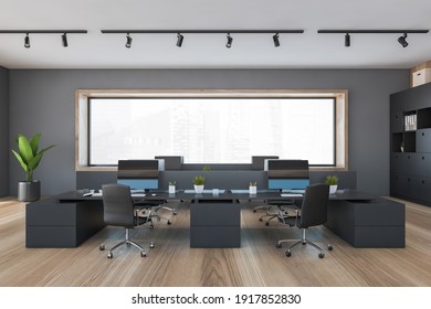 Office Room With Armchairs And Computers On Black Tables Near Window. Wooden And Black Manager Room With Modern Minimalist Furniture, 3D Rendering No People