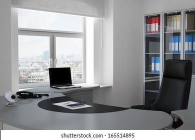 Office with urban view through window and grey table
