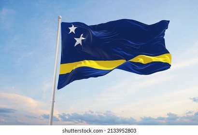 official flag of Curacao at cloudy sky background on sunset, panoramic view. patriot and travel concept. copy space for wide banner. 3d illustration