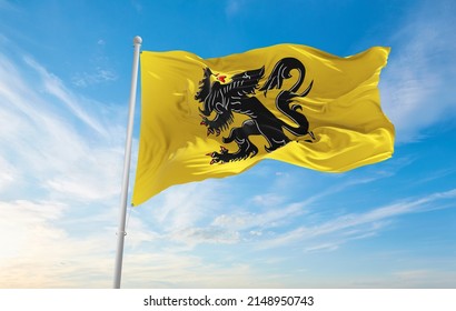 official flag of Flanders, Belgium at cloudy sky background on sunset, panoramic view. Belgian travel and patriot concept. copy space for wide banner. 3d illustration