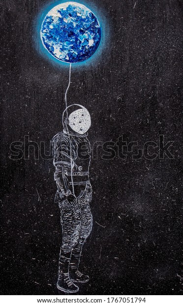 Oil
painting. The astronaut and the earth.
Background.