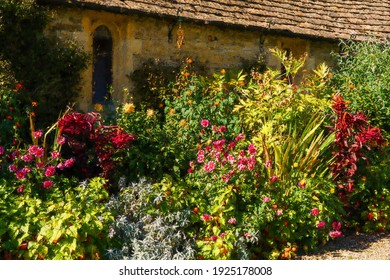 Oil Painting Of A Flower Filled Border In Brilliant Sunshine On A Summer Day In England