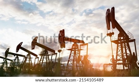 Oil pump jack work on oilfield. Drill and petroleum extraction 3d render