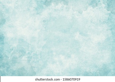 Old blue paper parchment background design with distressed vintage watercolor or water stains and ink spatter and white faded shabby center, elegant antique pastel blue color