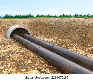 Old And Dirty Underground Pipes In A Trench Are Stretching Out Of Concrete Pit, 3d Illustration