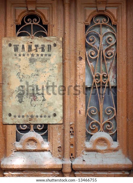 old-door-with-wild-west-styled-poster-the-broken-glasses-and-the