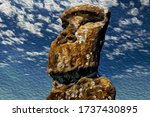 Old monolithic human figures called Moai carved by the Rapa Nui people on fields at Easter Island. A World Heritage Site located in the middle of the Pacific Ocean on western Chile. Oil paint filter.
