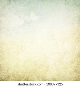 old paper grunge background with delicate abstract canvas texture and blue sky view