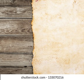 Old paper on the wood background