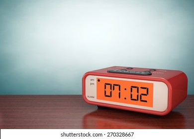 Old Style Photo. Digital Alarm Clock On The Table