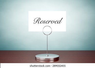 Old Style Photo. Note Paper Card Holder With Reserved Sign On The Table