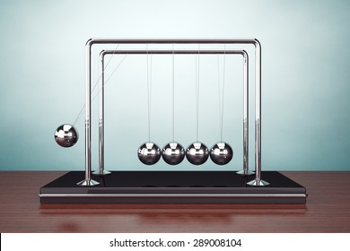 Old Style Photo. Perpetual Motion Spheres Of Newton On The Table