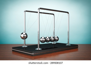 Old Style Photo. Perpetual Motion Spheres Of Newton On The Table