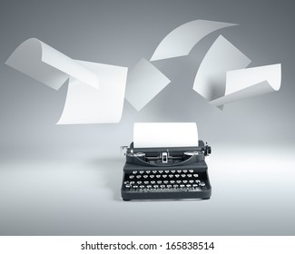 Old type writer with paper sheets flying