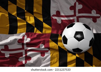 Old, Vintage Football Ball On The Waveing Maryland State Flag Background. 3D Illustration