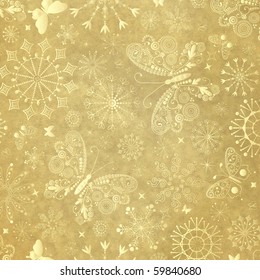 Old yellow christmas paper with snowflakes and  butterflies
