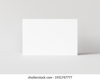 One Blank Horizontal Rectangle Poster Template Standing On White Table With White Background. 3D Illustration