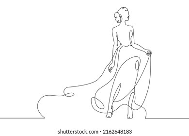 One Continuous Line.A Woman In A Beautiful Dress.Women's Fancy Dress. Female Character In A Holiday Dress. Long Pretty Hair.Portrait Of A Young Woman.One Continuous Line Is Drawn On A White Background