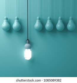 One Hanging Eco Energy Saving Light Bulb Glowing And Standing Out From Unlit Incandescent Bulbs On Green Pastel Wall Background , Leadership And Different Creative Idea Concepts . 3D Rendering.