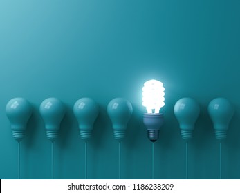 One Hanging Eco Energy Saving Light Bulb Glowing And Standing Out From Unlit Incandescent Bulbs On Green Pastel Color Wall Background  Leadership And Different Creative Idea Concepts 3D Rendering