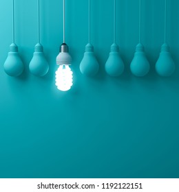 One Hanging Eco Energy Saving Light Bulb Glowing And Standing Out From Unlit Incandescent Bulbs On Dark Green Pastel Color Wall Background Leadership And Different Creative Idea Concepts 3D Rendering