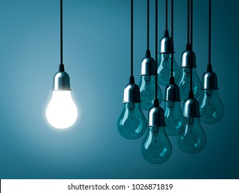 One hanging light bulb glowing and standing out from unlit incandescent bulbs on dark green pastel color background. 3D rendering.