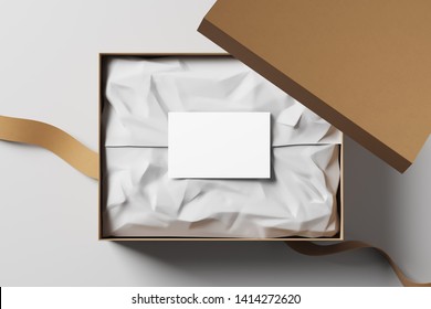 Open Realistic Cardboard Box With White Packaging Card And Fabric Tape. The Concept Of A Business Gift. Mock Up. Top View. 3d Rendering