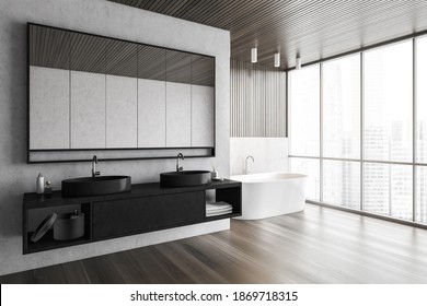 Open Space Bathroom With Two Black Sinks And Large Mirror, Big White Bathtub Near Window With City View. Minimalist Design Of Luxury Bathroom In Apartment, 3D Rendering No People