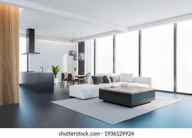 Open Space Home Interior With White Sofa On Grey Carpet, Black Floor. Kitchen Set, Faucet And Hood, Dining Table With Chairs, City View On Skyscrapers, 3D Rendering No People