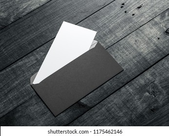 Opened Black Envelope With White Invitation Or Letter Mockup Inside On Wooden Table, 3d Rendering