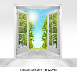 Opened door to morning in green landscape - conceptual image - environmental business metaphor.