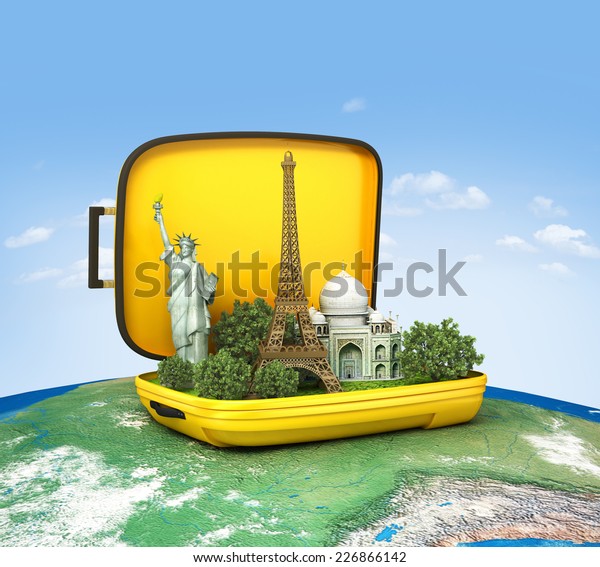 Opened suitcase with world famous monuments\
inside. Unusual traveling concept.\
